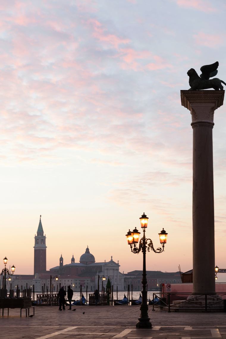 ITALY, Venice.  A view of the Column of the Lion on the right at the Piazza San Marco. The island of San Giorgio Maggiore can be seen in the distance, dominated by the tower and dome of the Church of 
