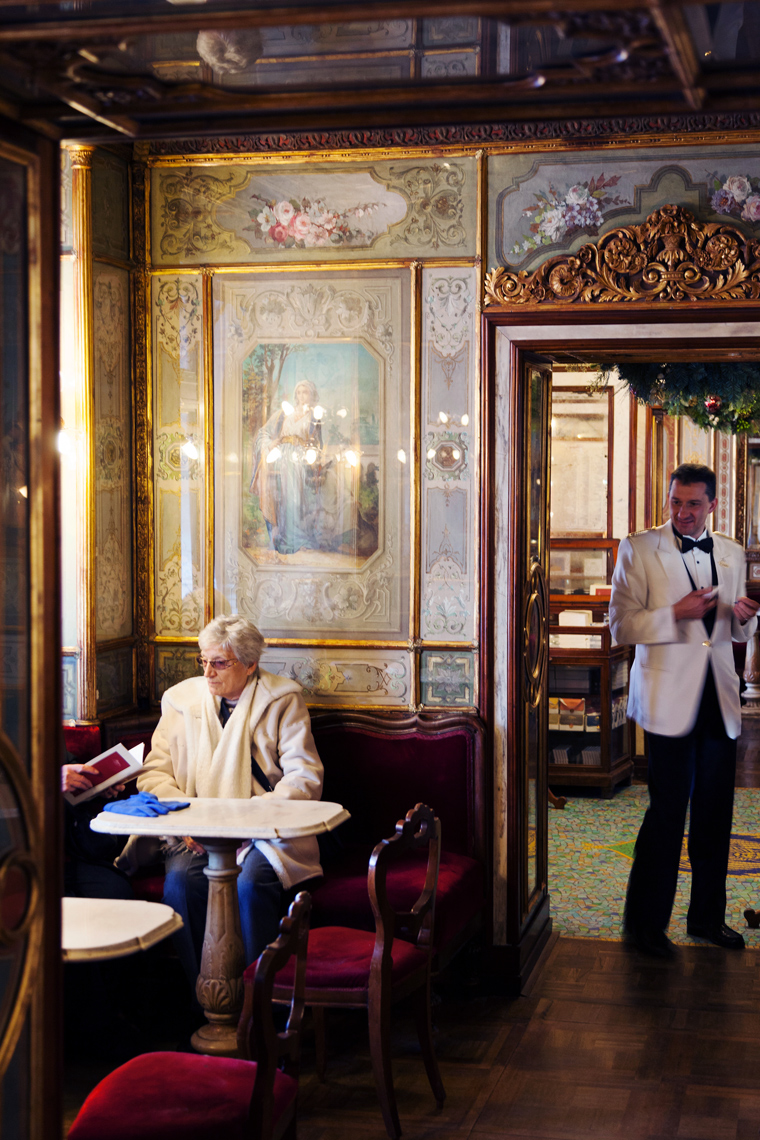 ITALY, Venice. A waiter checks on customers at Caffe Florian located in Piazza San Marco.