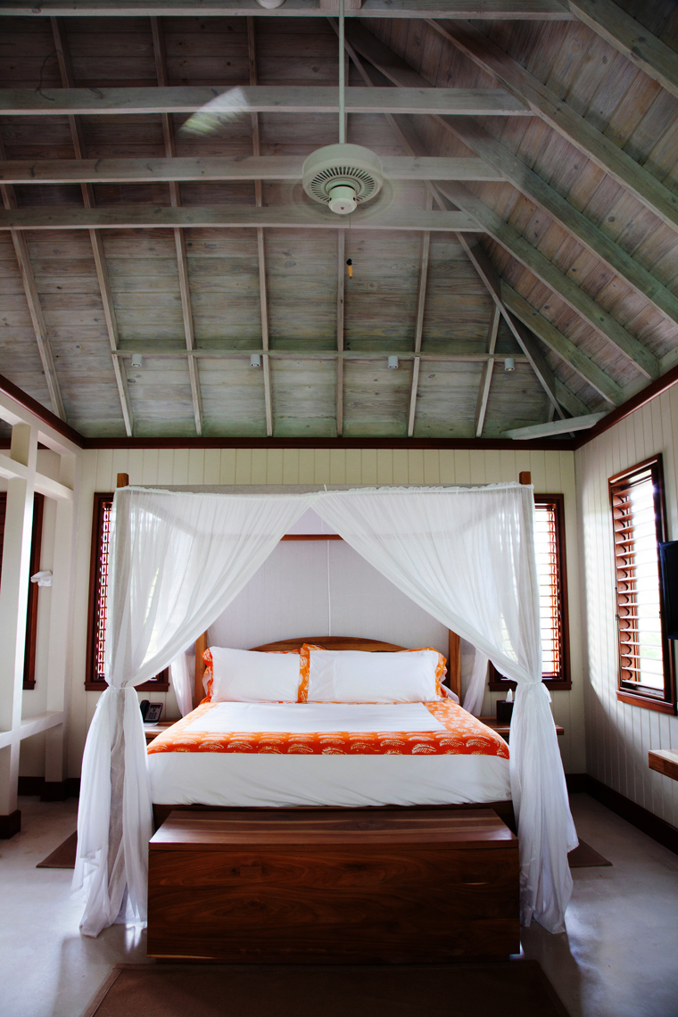 JAMAICA, Oracabessa. Goldeneye Hotel and Resort. A bedroom in a bungalow at the resort.
