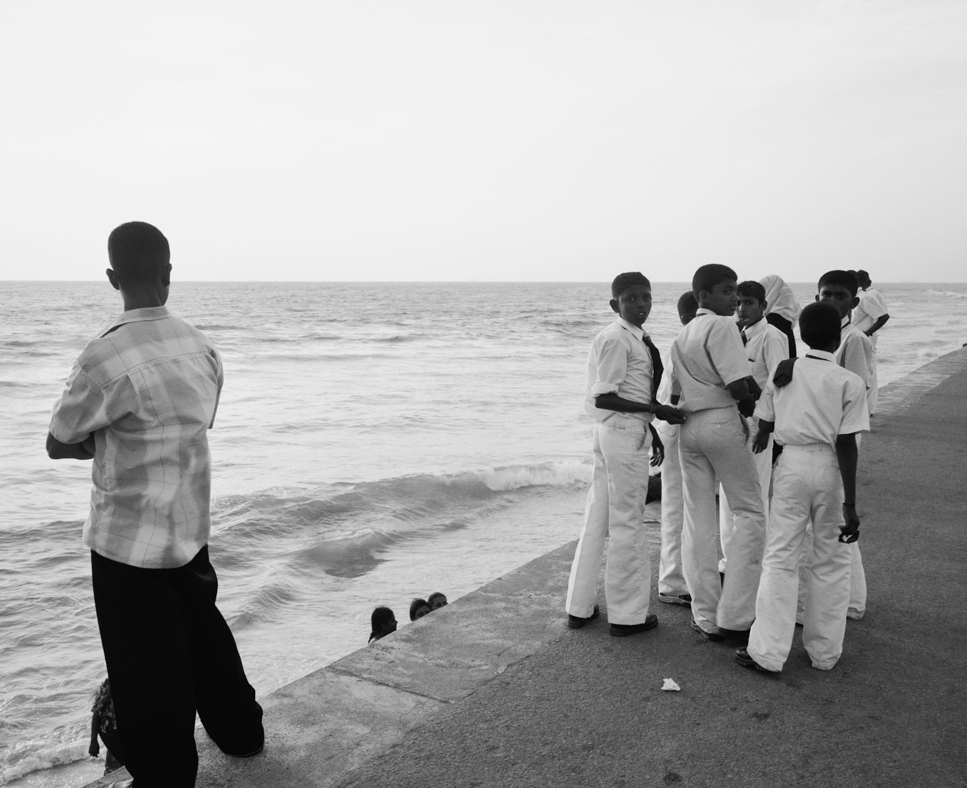 SRI LANKA Asia, Colombo, school boys standing by the beach in Colombo.