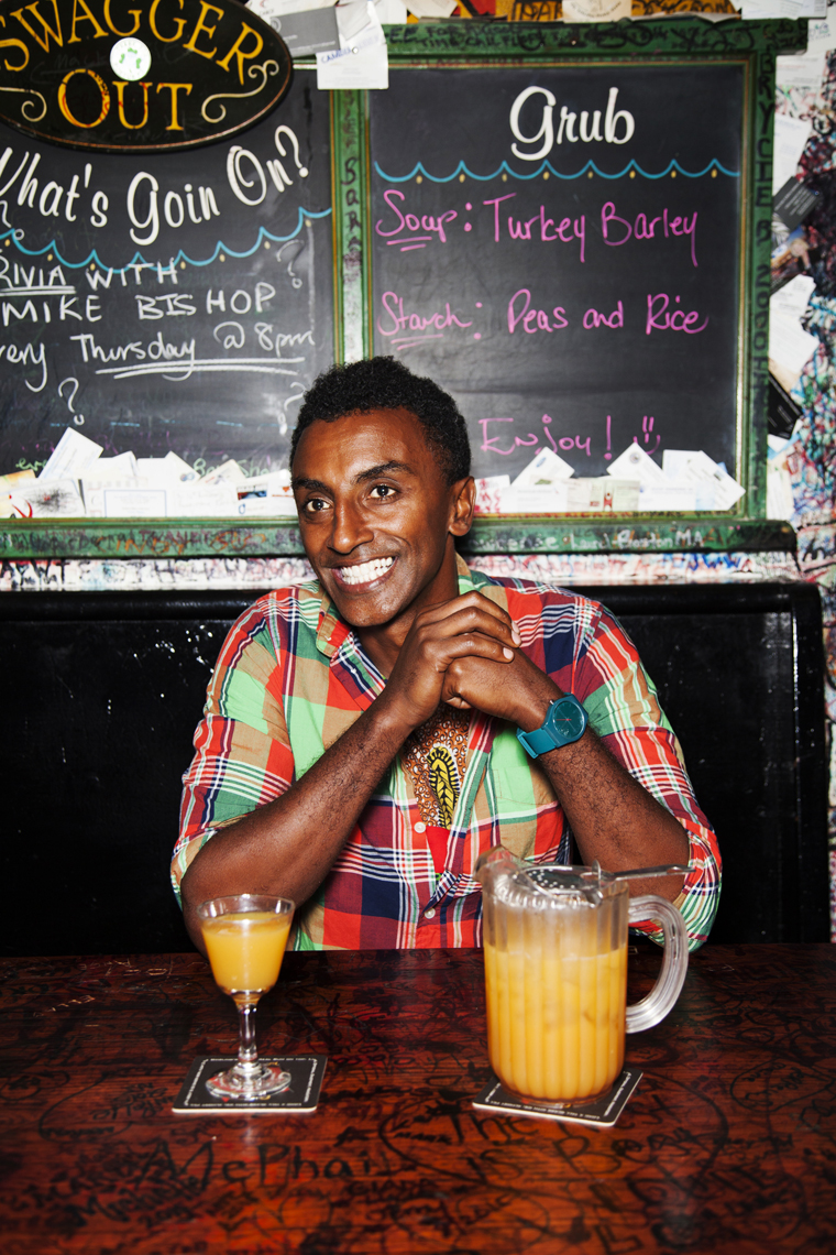 BERMUDA. Chef Marcus Samuelsson having the famous Rum Swizzle at the Swizzle Inn at Bailey